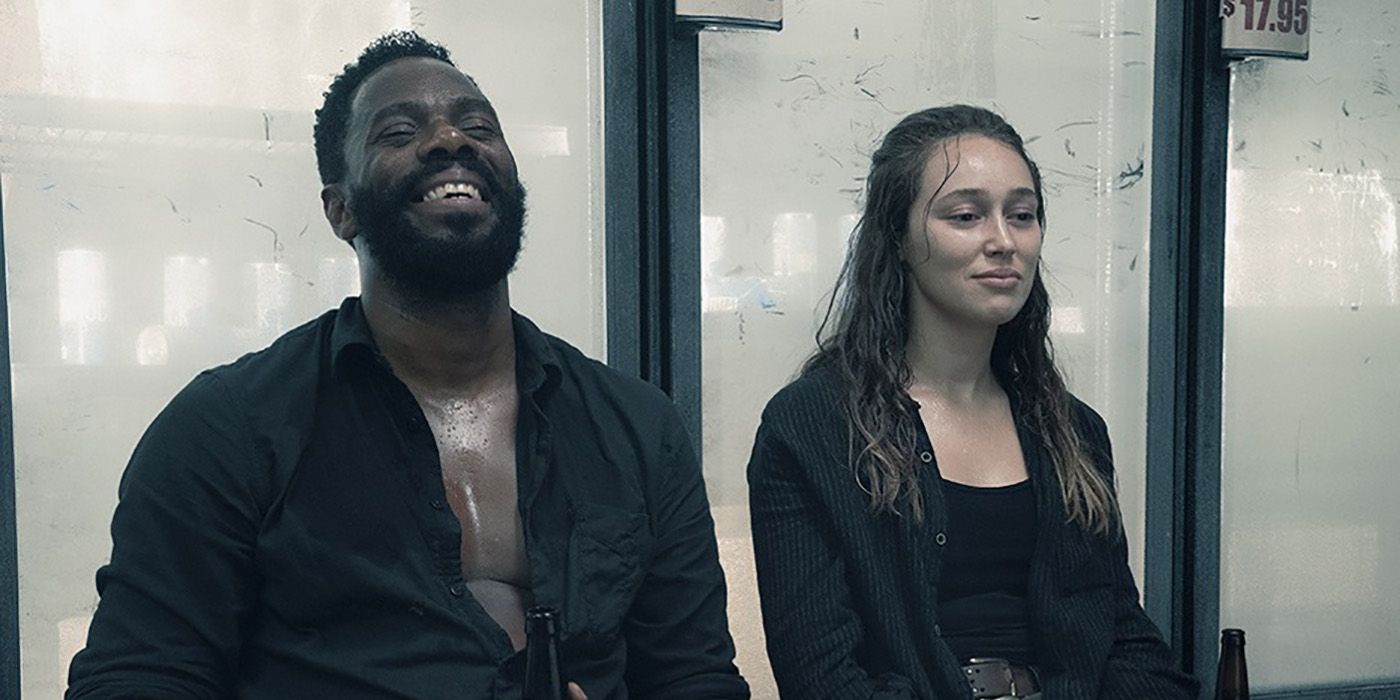 Victor and Alicia sitting together, laughing on Fear the Walking Dead.