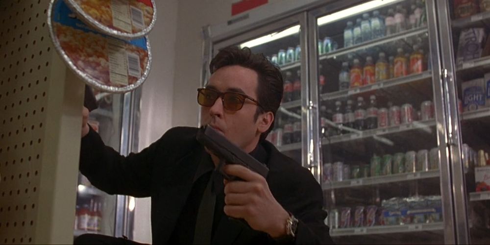 Martin holds a gun in a liquor store in Grosse Pointe Blank
