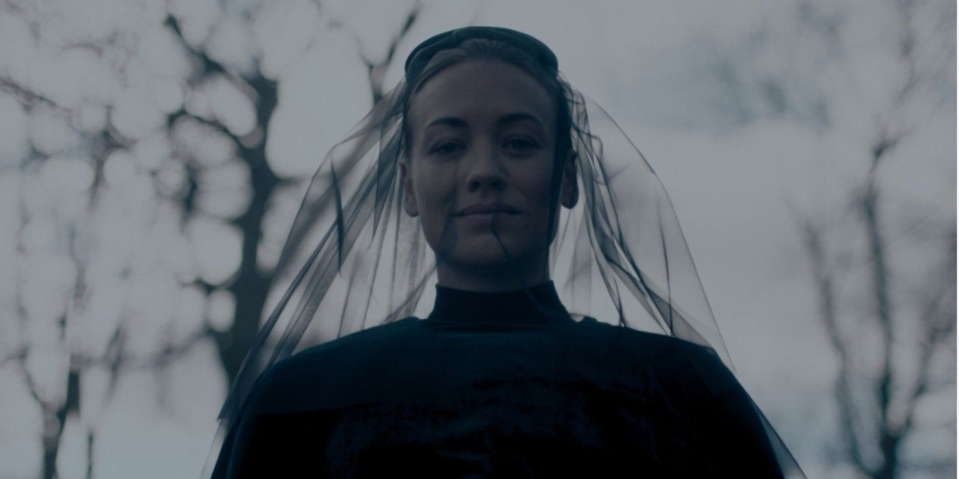 Serena Joy Waterford from The Handmaid's Tale dressed in black with a black veil, looking down.