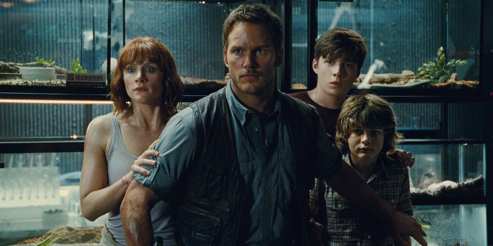 Owen protects Claire and the kids from an attack in Jurassic World