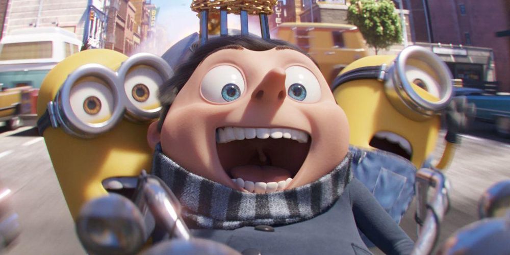 Gru smiles while riding on the handle bars in Minions: The Rise of Gru