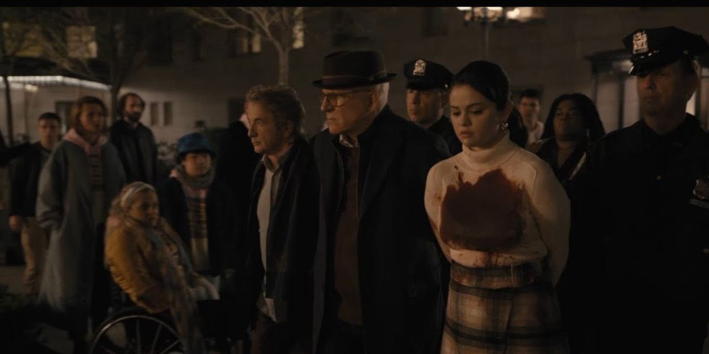 Oliver, Charles, and Mabel being arrested outside, with everyone looking on in a scene from Only Murders in the Building.
