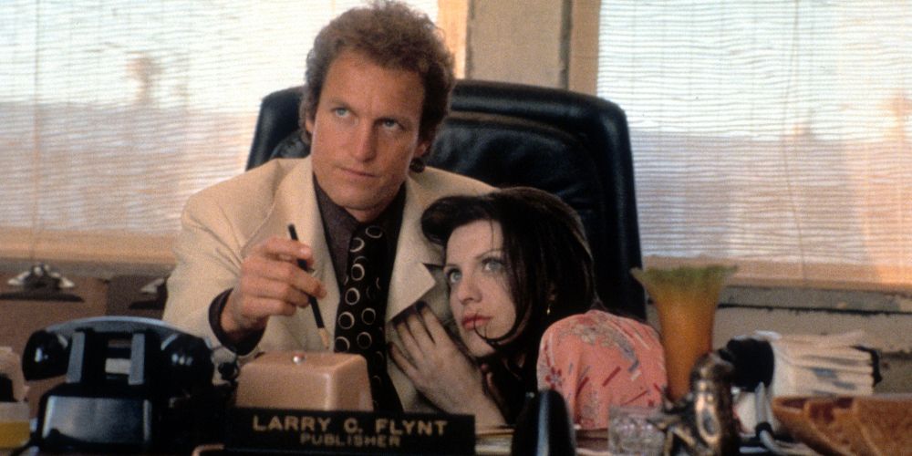 Larry sits at his desk with Althea in The People vs. Larry Flynt