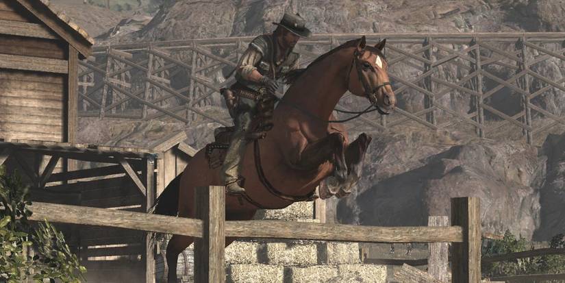 A horse hops a fence in Red Dead Redemption