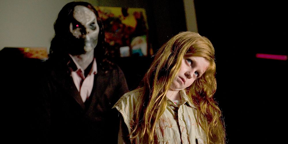 The killer stands behind Ashley in Sinister