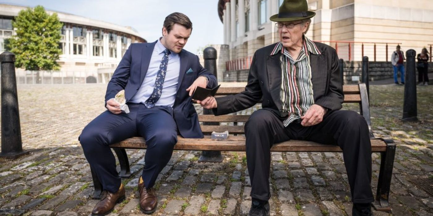 Spencer and Frank sat on a bench in The Outlaws
