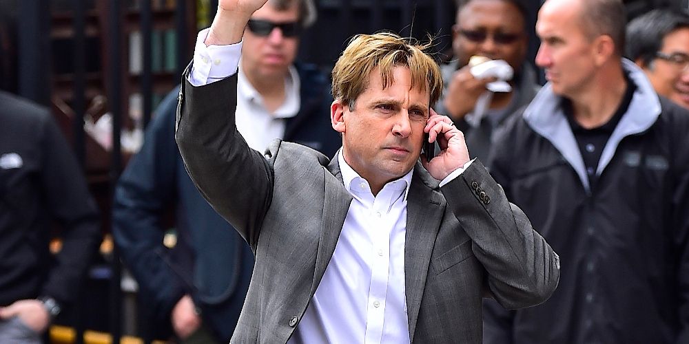 Mark hails a cab while talking on the phone in The Big Short