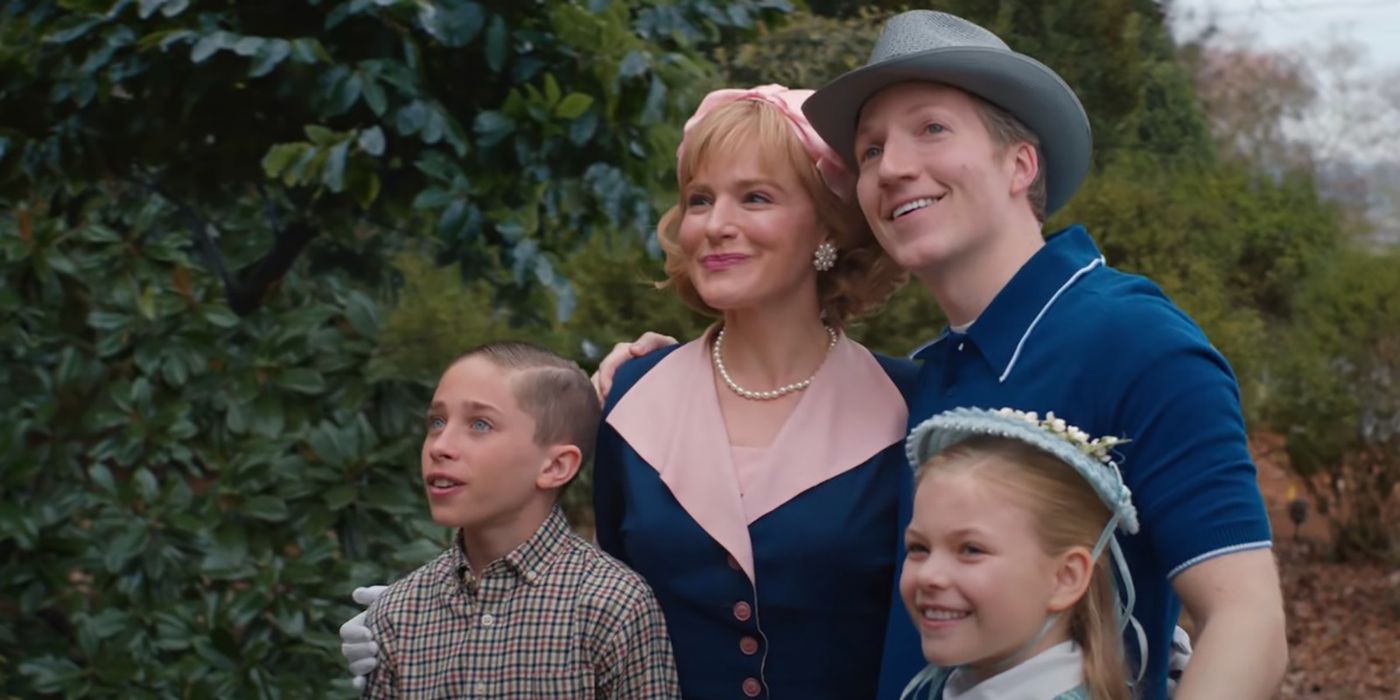 The Creel family from Stranger Things embracing, looking happily at the new house.