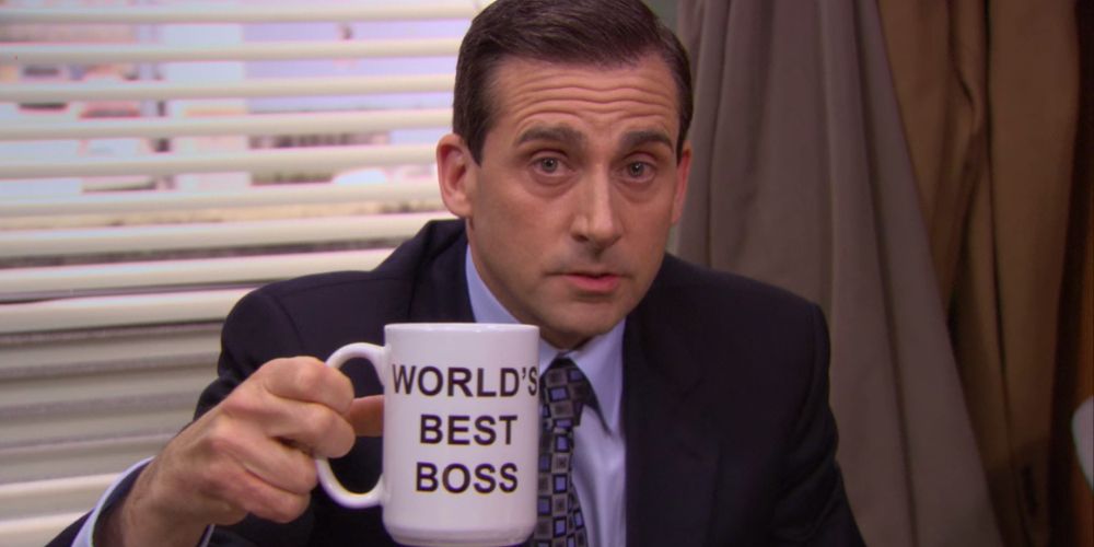 Michael holds a &quot;World's Best Boss&quot; coffee mug in The Office
