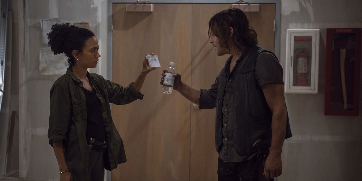 Connie from The Walking Dead showing Daryl her notebook with a message on it for him to read.