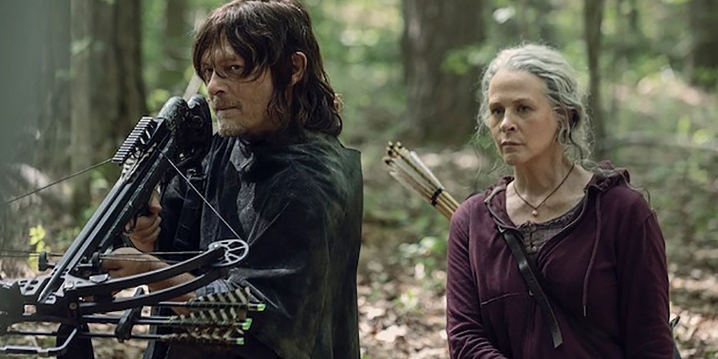 Daryl from The Walking Dead holding his bow and arrow, Carol standing beside him.