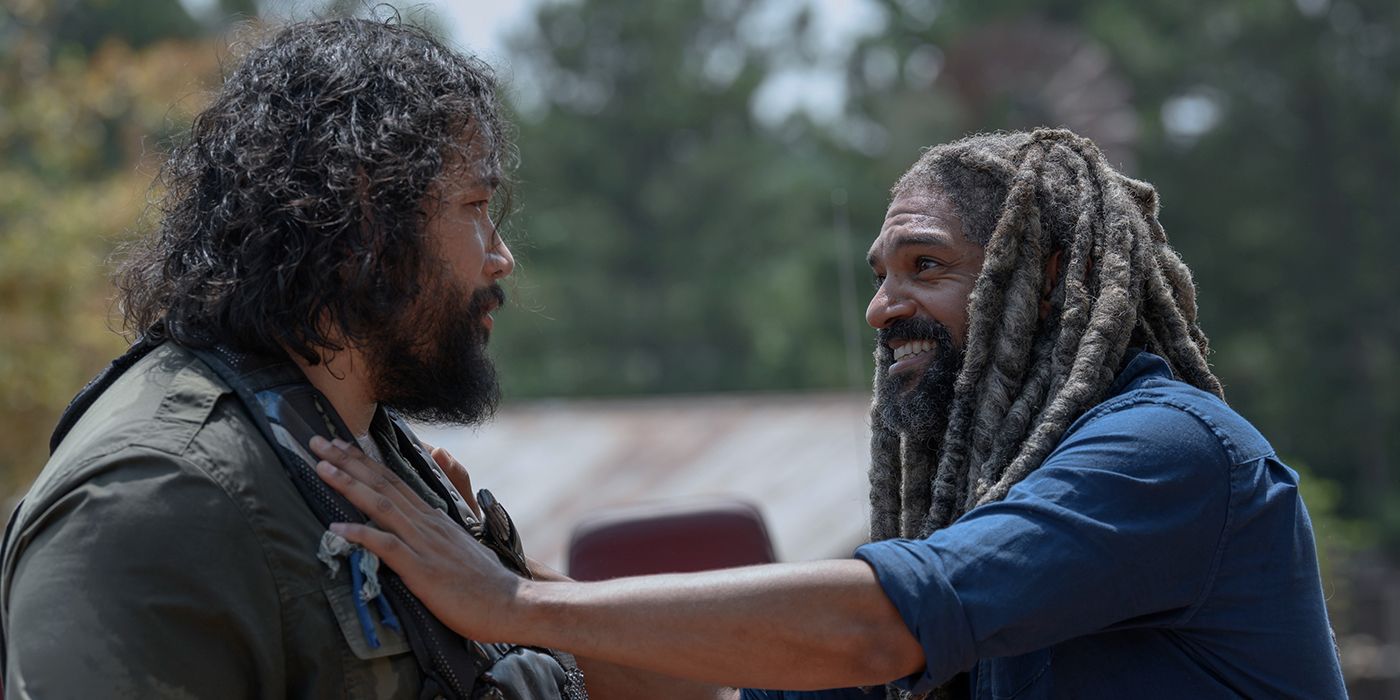 Ezekiel from The Walking Dead with his arm on Jerry's shoulder.