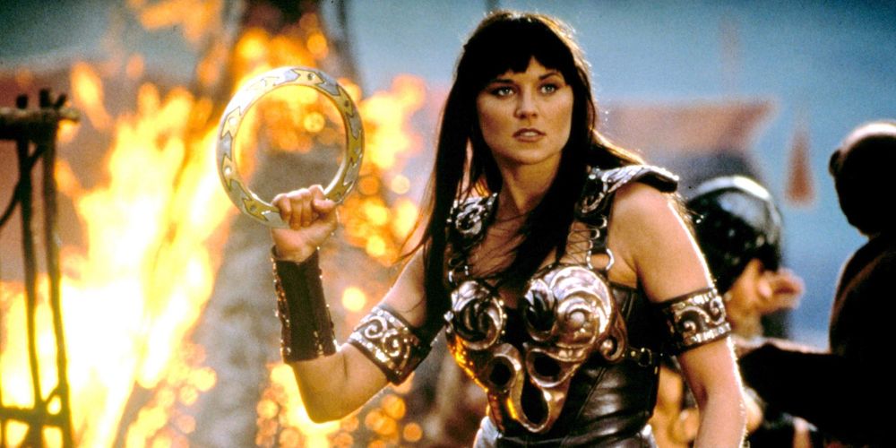 Xena holds a fiery relic in Xena: Warrior Princess