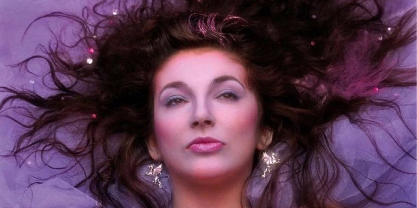 Running Up That Hill (A Deal With God) By Kate Bush, with Kate posing and laying on the ground with a purple background