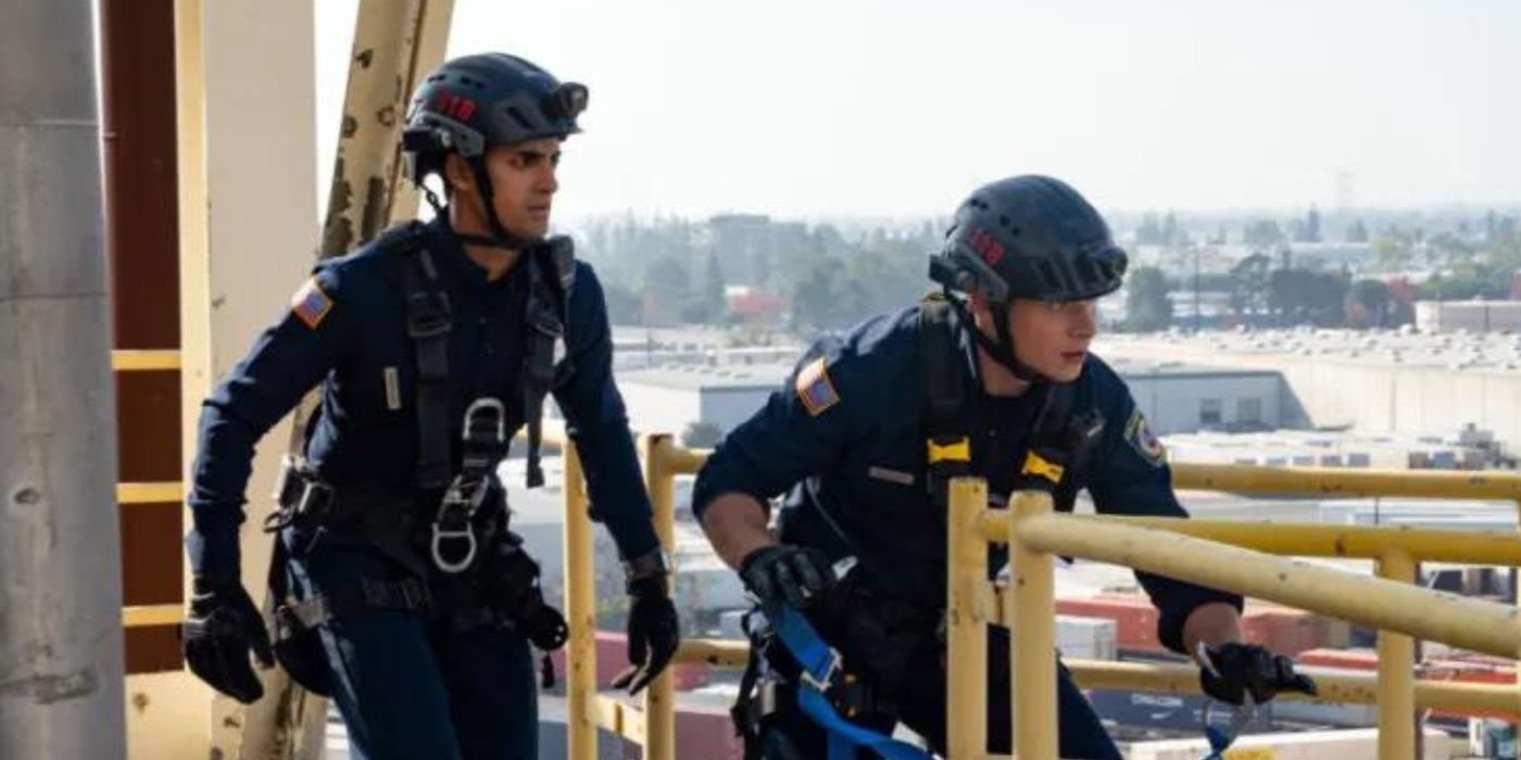 Buck and Ravi on top a high rise wearing protective gear