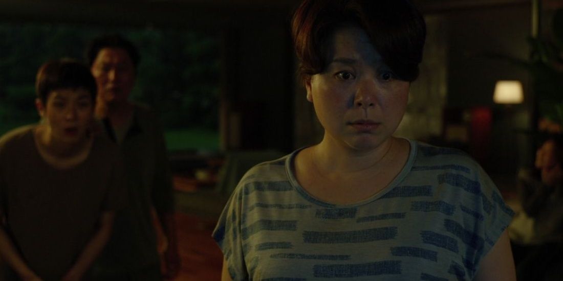 An image of Choong-sook looking upset in Parasite