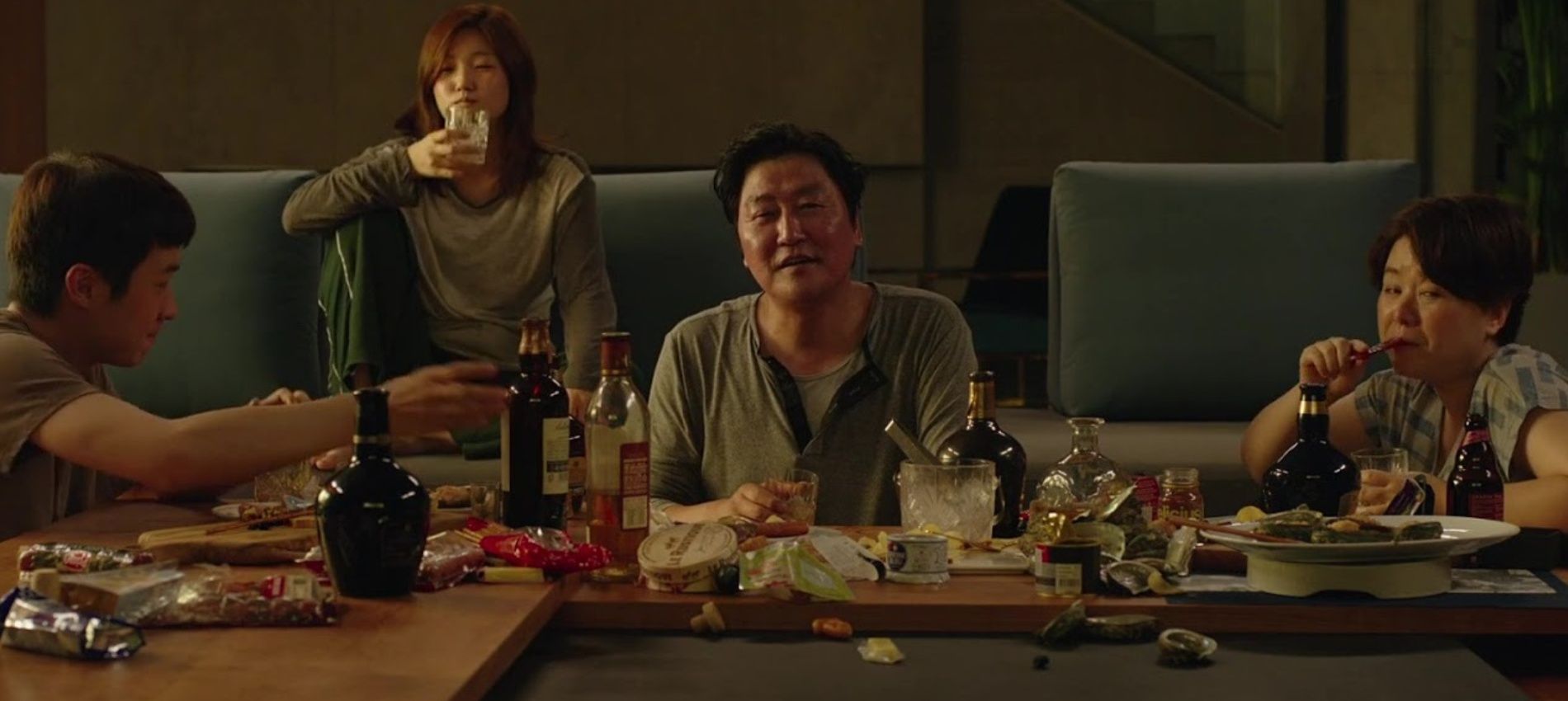 An image of the Kim family sitting together in Parasite
