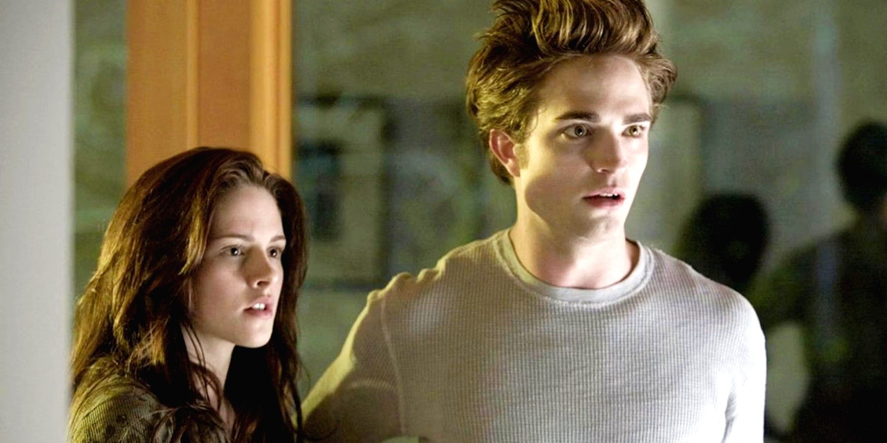 Bella and Edward standing together in the Twilight Saga movies