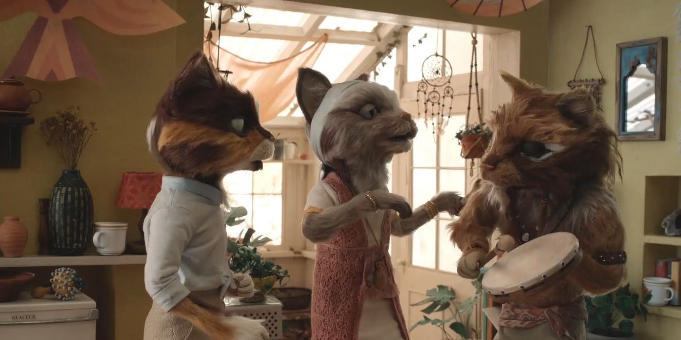 Three anthropomorphic cats talking in the kitchen in the 2022 movie The House.