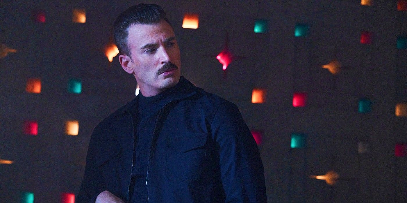 Chris Evans as Lloyd in front of a colorful wall in The Gray Man