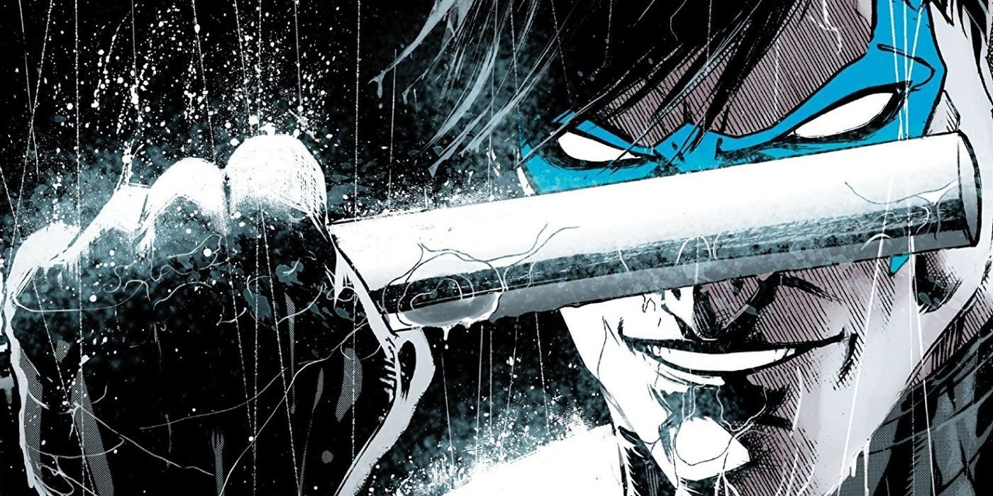 A close-up of Nightwing holding his escrima stick.