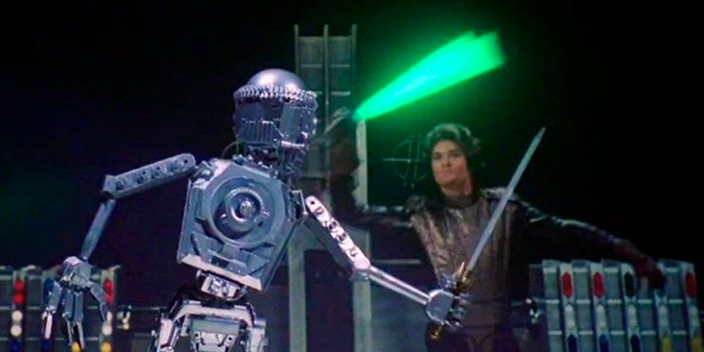 David Hasselhoff as Prince Simon using the lightsaber laser sword against a sword wielding robot in Starcrash