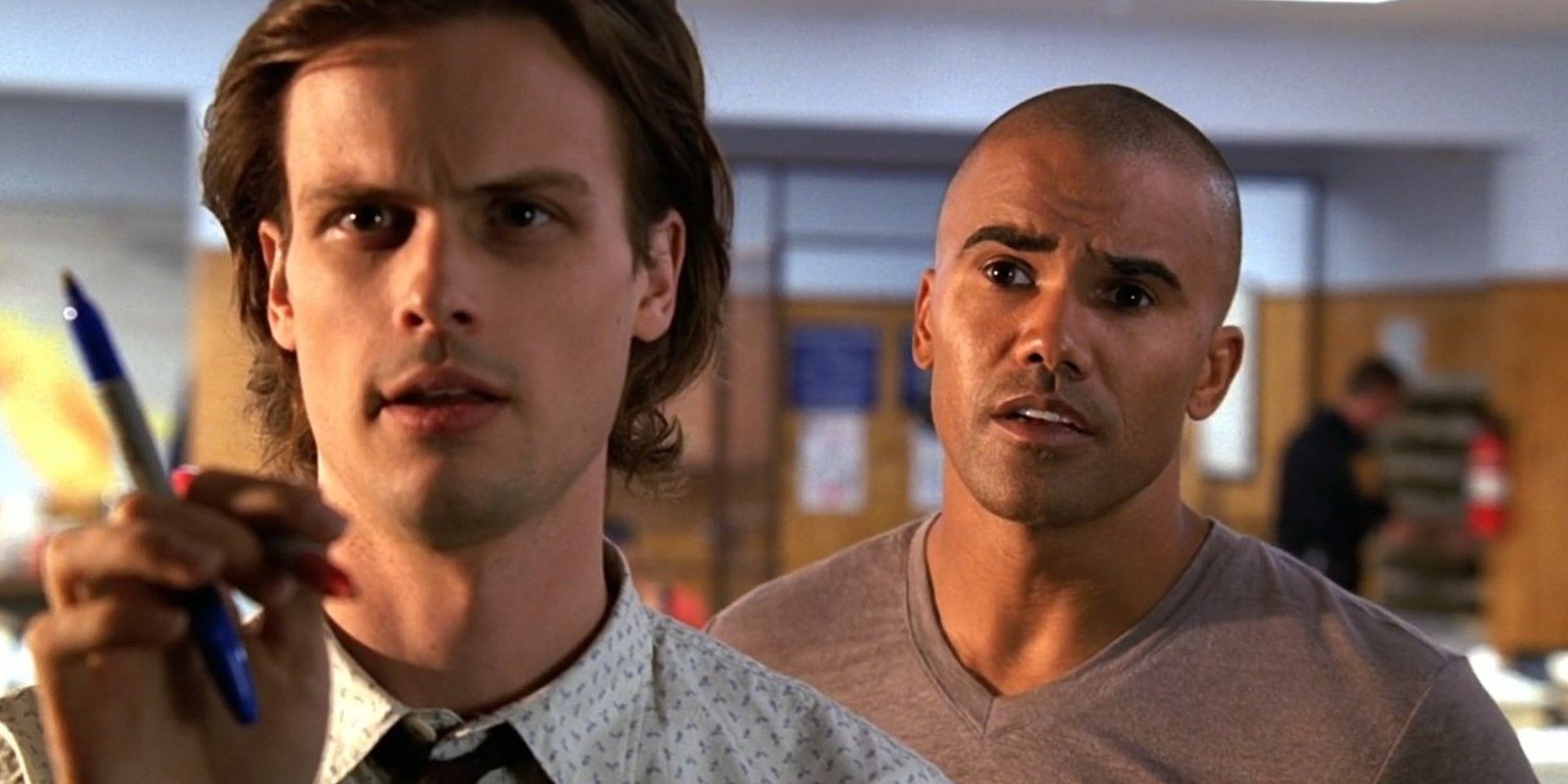 Spencer Reid Stood In Front Of Whiteboard, Derek Morgan Behind Him