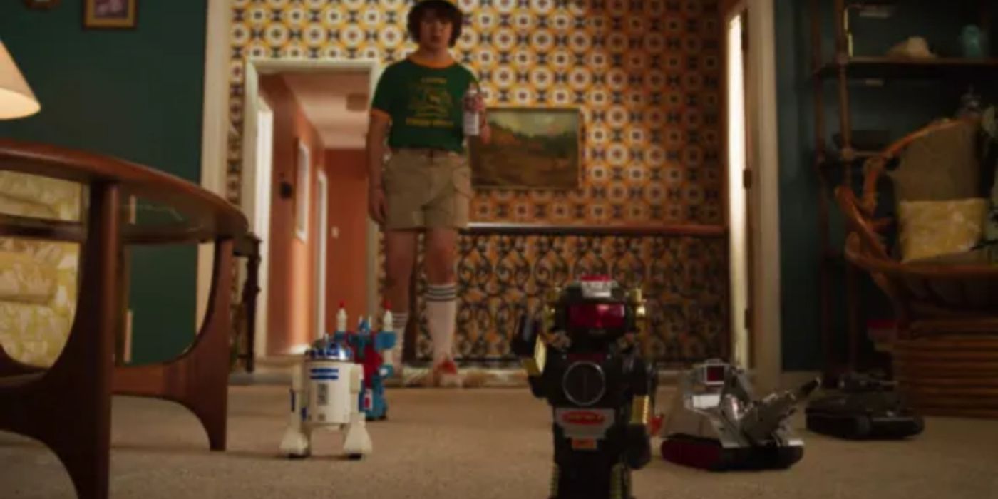 Dustin follows his robot toys in Stranger Things