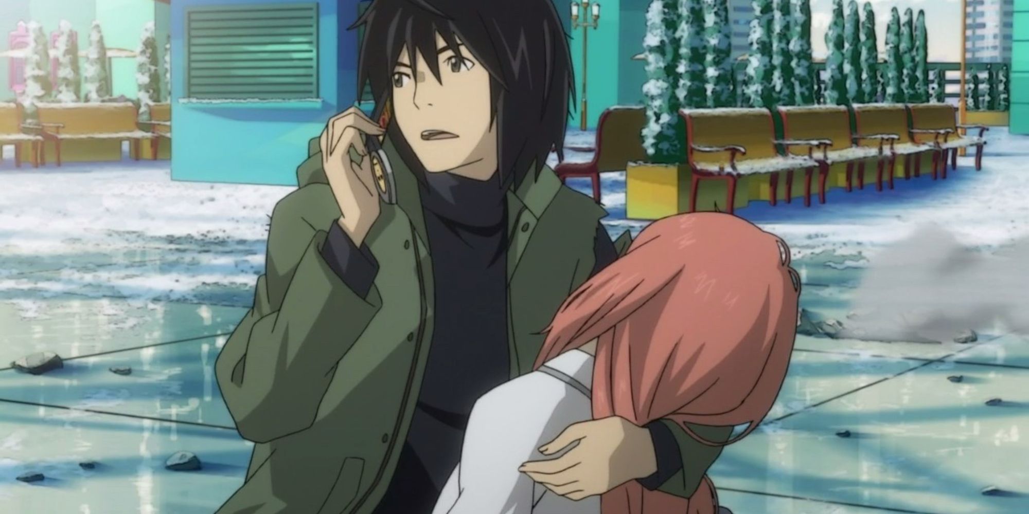 Akira cradles a wounded Saki while calling in for help
