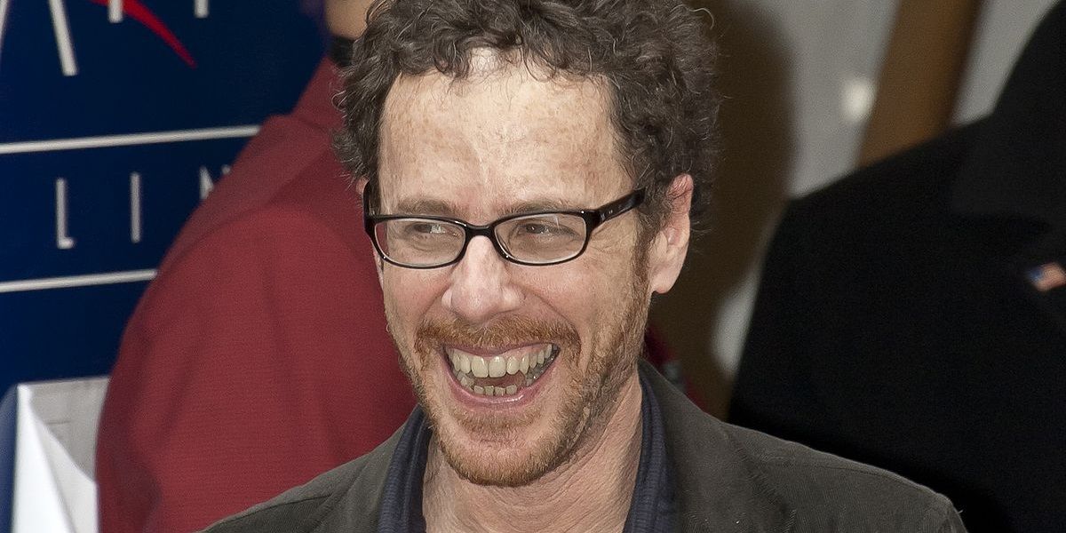 Ethan Coen smiling at an event