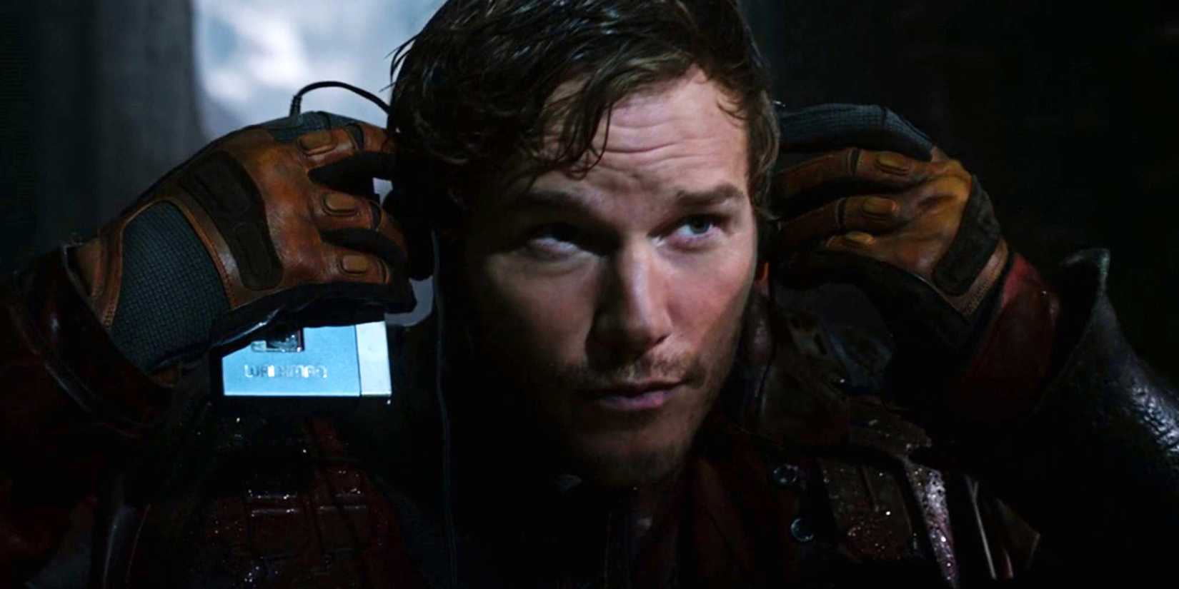 Chris Pratt as Star-Lord putting on headphones to listen to the Awesome Mix in Guardians of the Galaxy