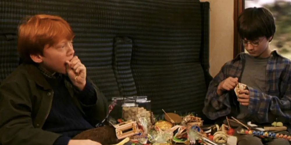 Harry and Ron eating candy in their first trip to Hogwarts