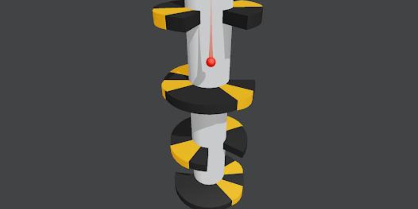 A red ball going down a tube in the game Helix Jump.