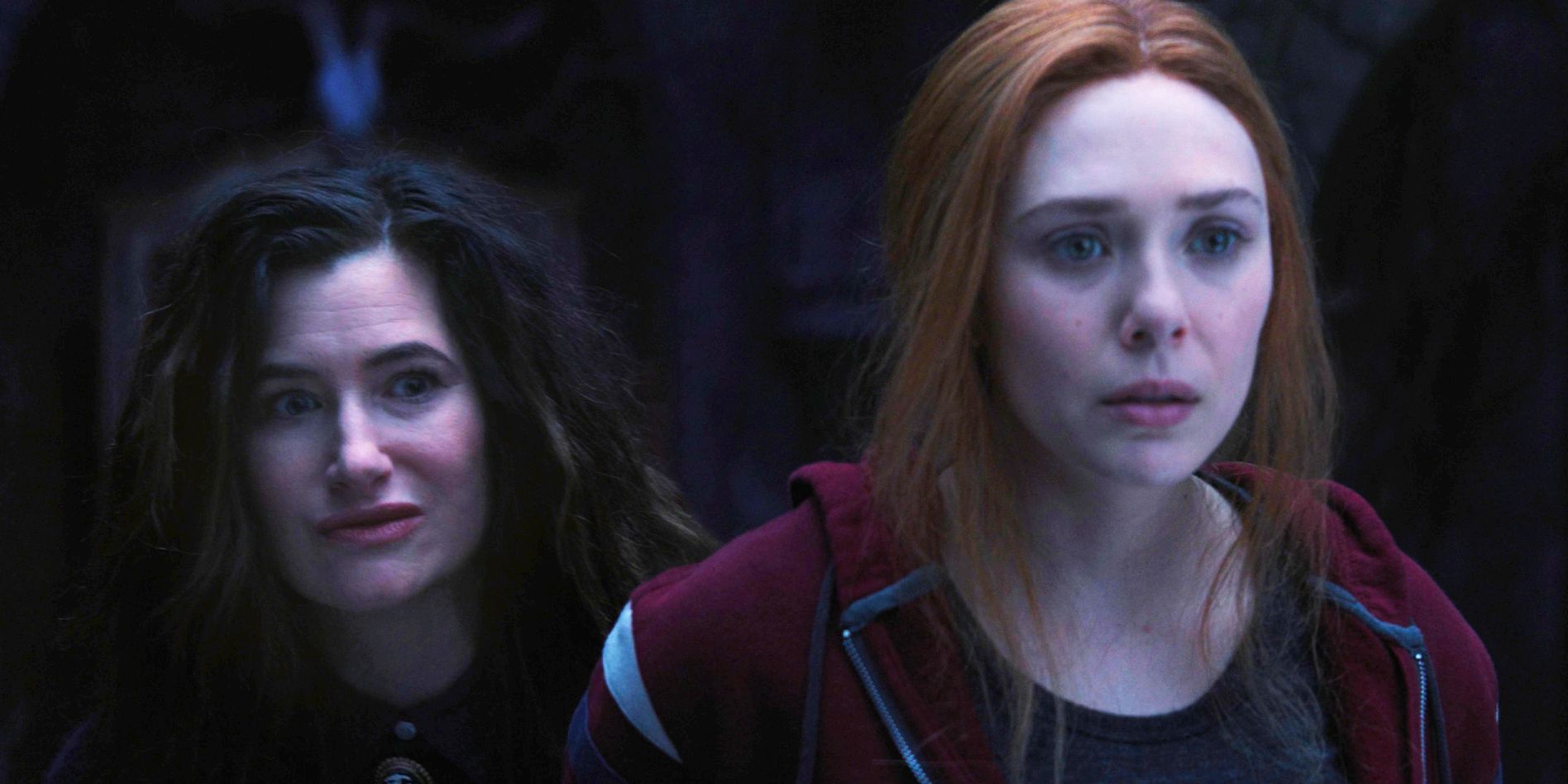 Kathryn Hahn as Agatha Harkness and Elizabeth Olsen as Wanda Maximoff Scarlet Witch looking concerned in WandaVision