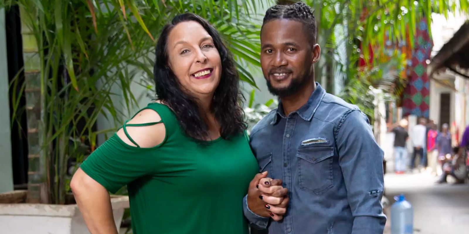 Kim Menzies in green top and Usman Umar Sojaboy in corduroy shirt for 90 Day Fiancé Happily Ever After Season 7