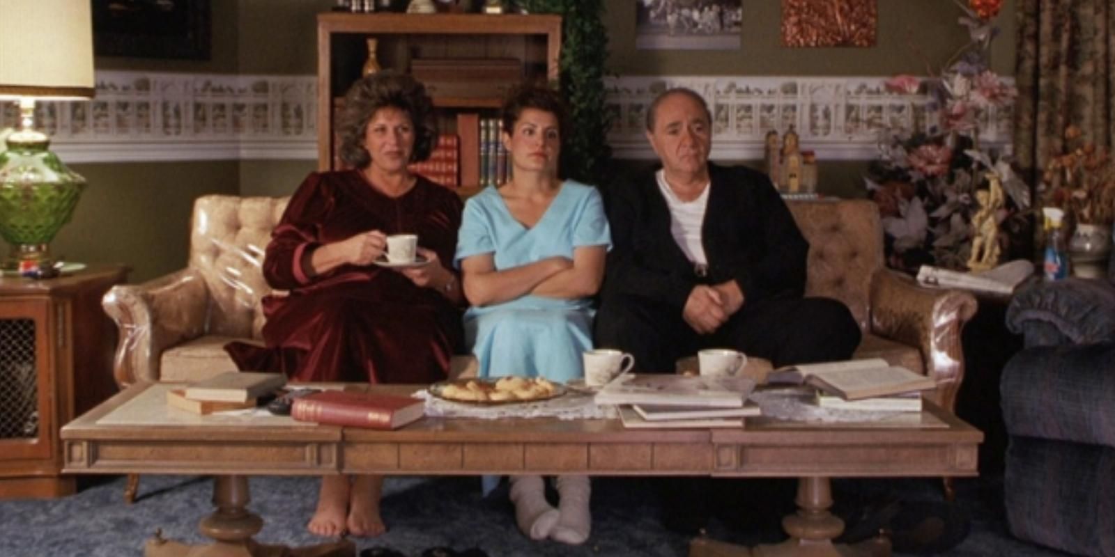 Maria Toula and Gus Portokalos sit together in the living room in My Big Fat Greek Wedding