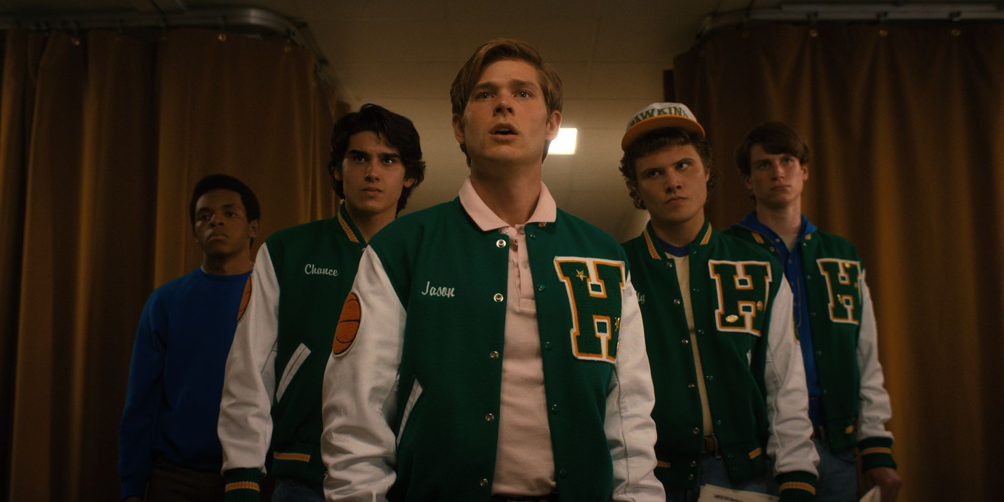 Mason Dye as Jason Carver in Stranger Things season 4 with his gang all wearing letterman jackets