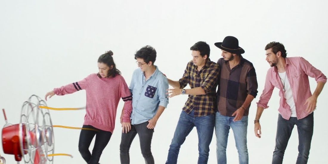 Members of Morat standing and looking sideways in the video for The Gong Gong Song 