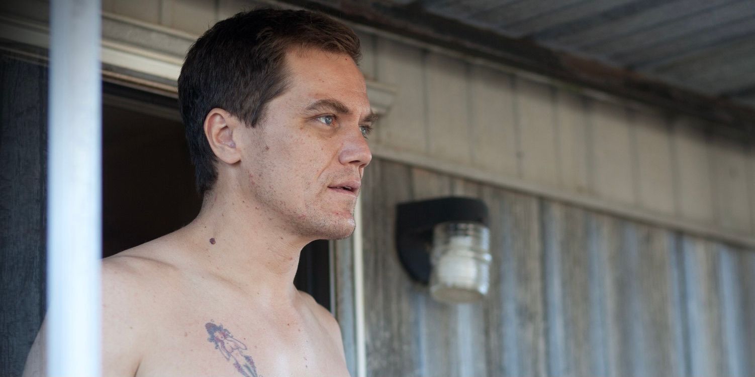 Michael Shannon standing in a doorway shirtless in Mud
