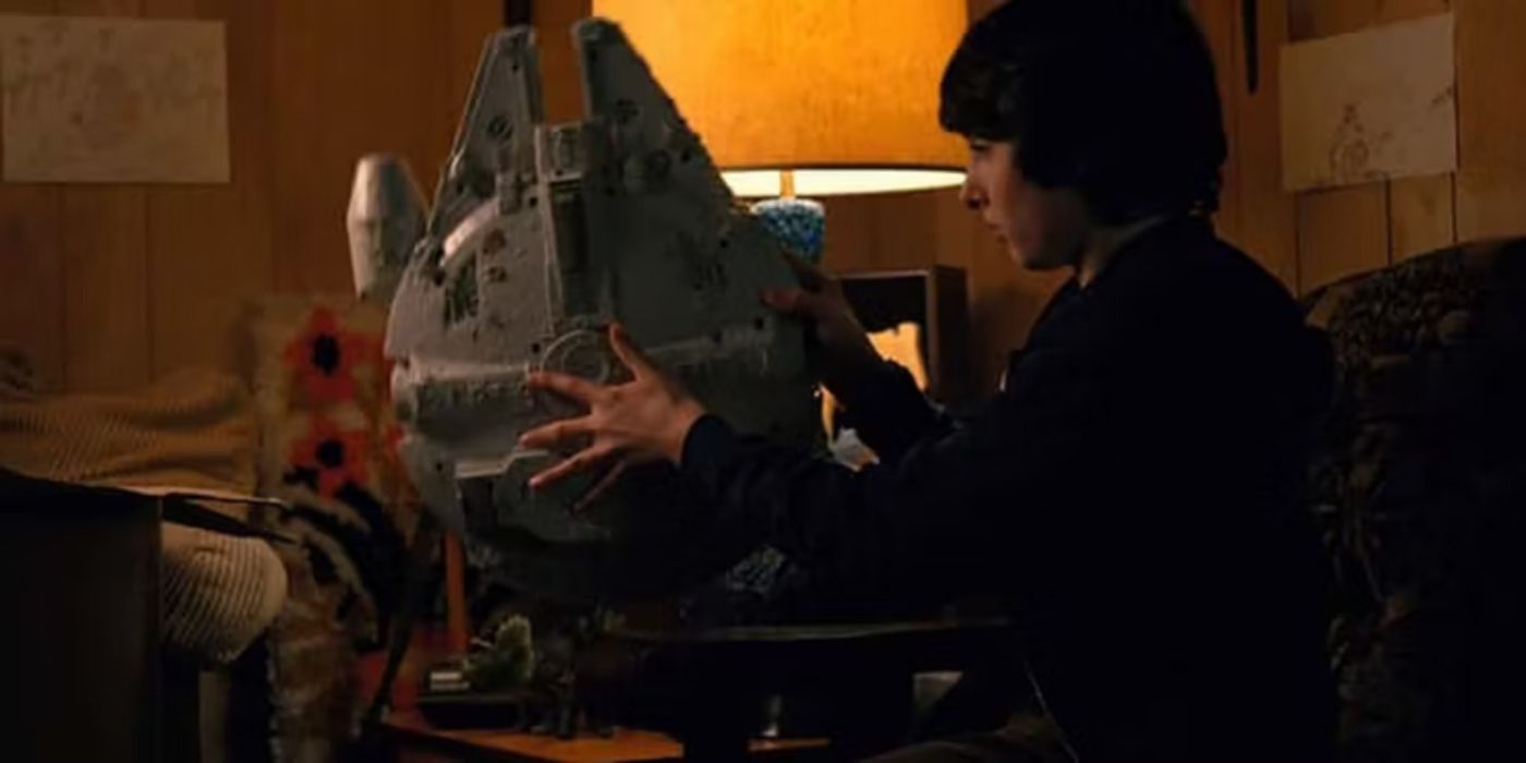 Mike with his Millennium Falcon toy in Stranger Things