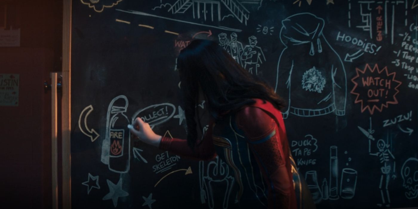 Kamala jots a plan on a chalkboard