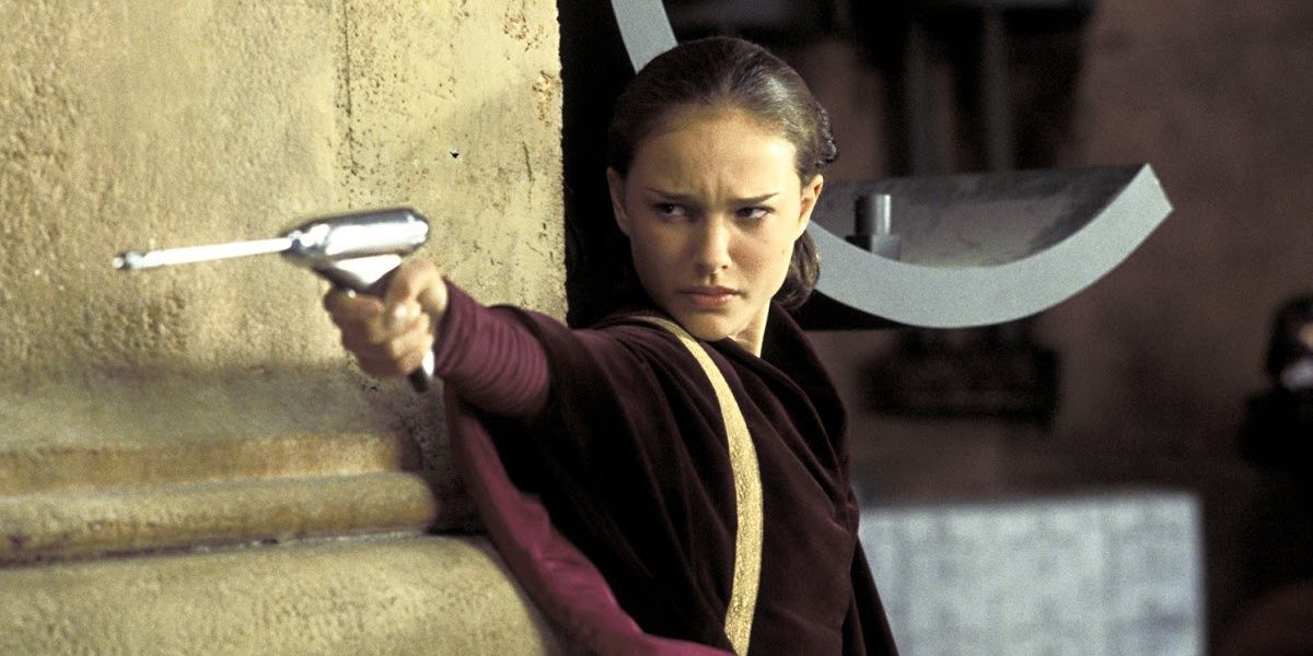 Padme aiming a blaster in Star Wars Episode I – The Phantom Menace 