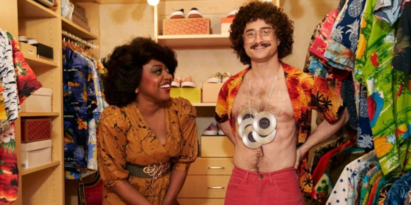 Quinta Brunson in character as Oprah Winfrey in Weird The Al Yankovic Story staring a funny moment with Daniel Radcliffe in character as Al Yankovic