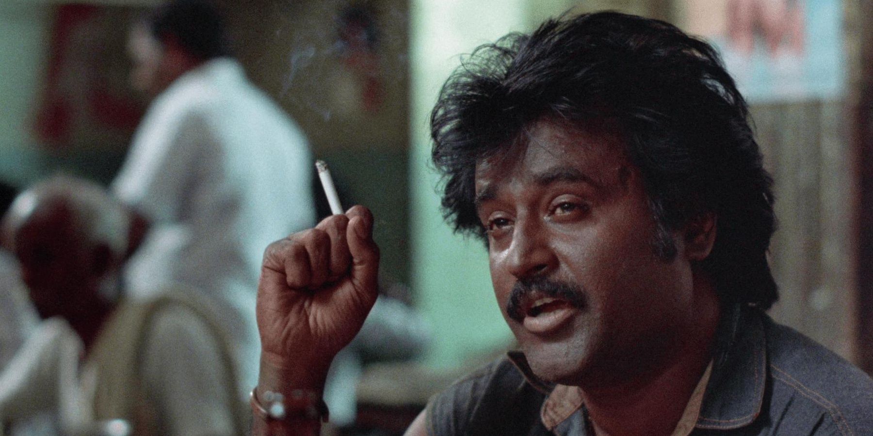 Rajnikanth holding a burnt cigarette in Bloodstone Cropped
