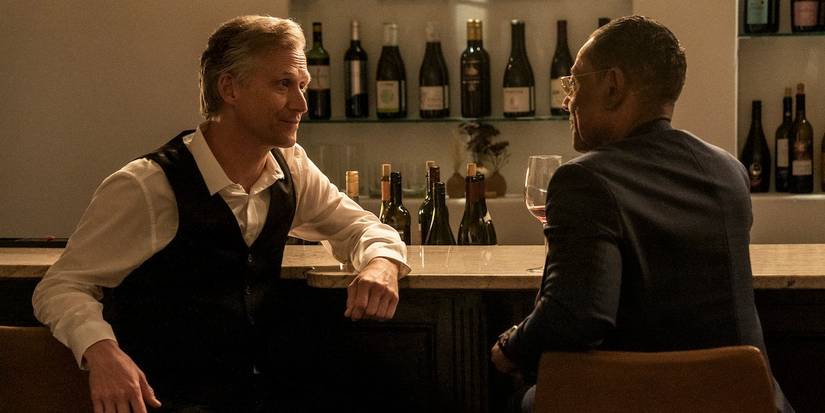 Reed Diamond as David and Giancarlo Esposito as Gus talking at a wine bar in Better Call Saul