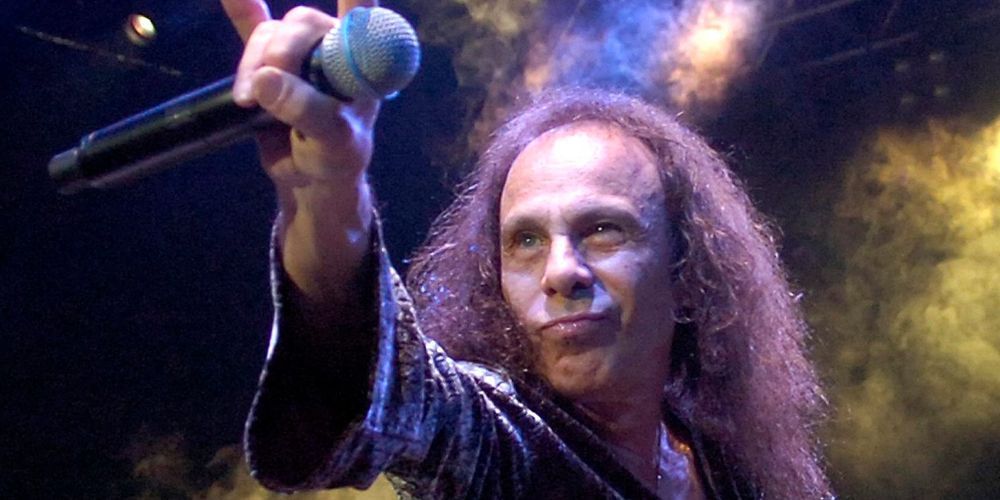 Ronnie James Dio gives the devil horns at a concert