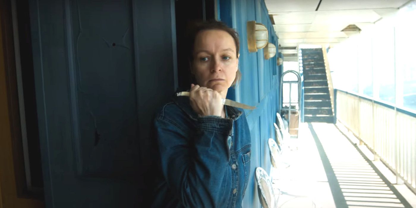 Samantha Morton in character as Alpha in Tales of the Walking Dead holding a knife in a hallway