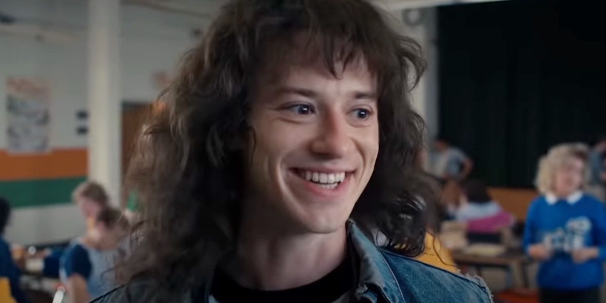 Eddie Munson smiling at school in season 4 of Stranger Things