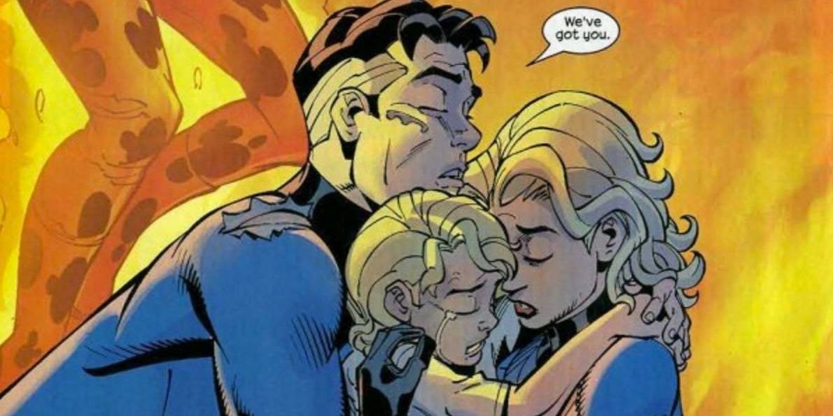 Sue, Reed and their child hugging after a battle.