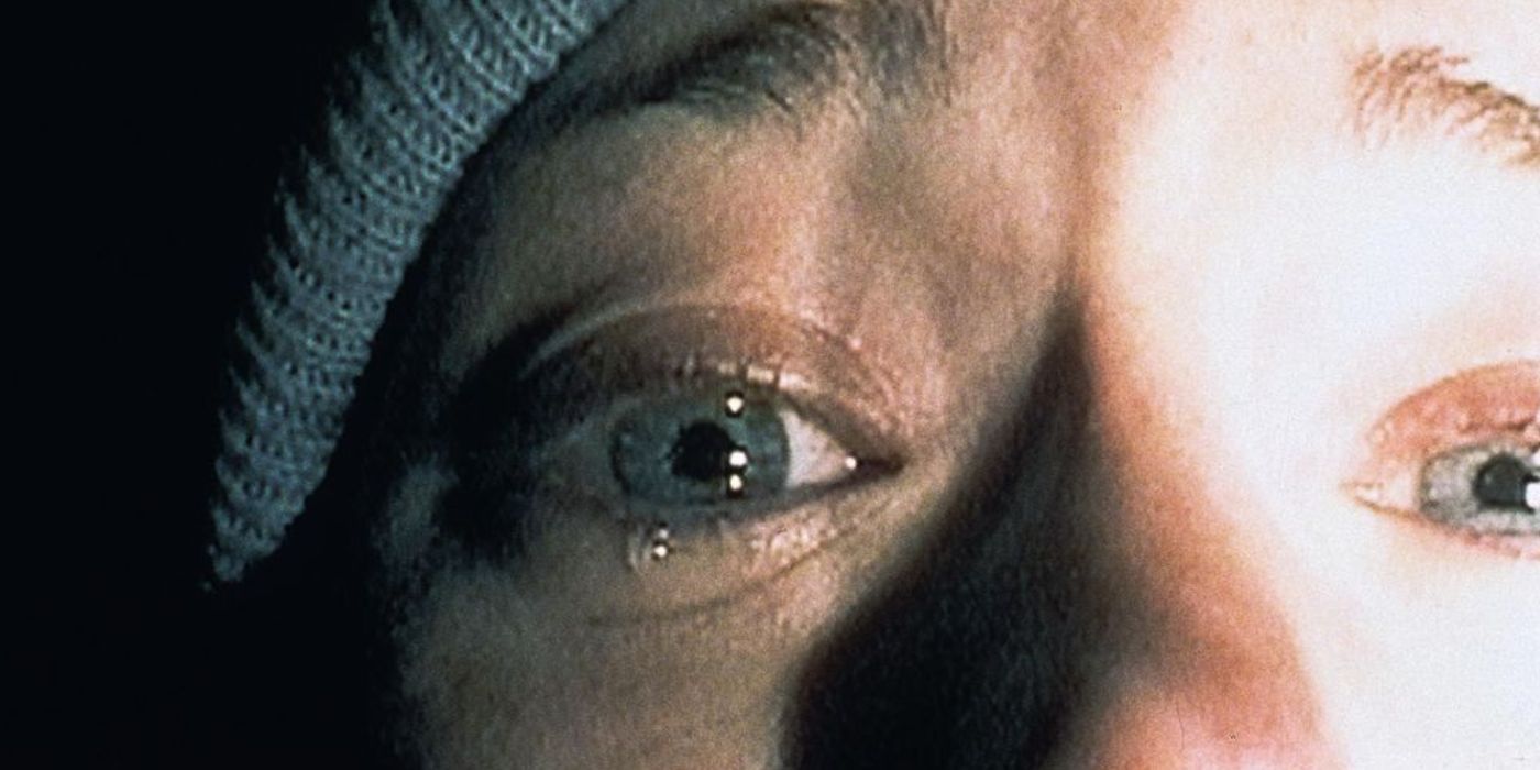 Heather Donahue cries while holding a camera in The Blair Witch Project 